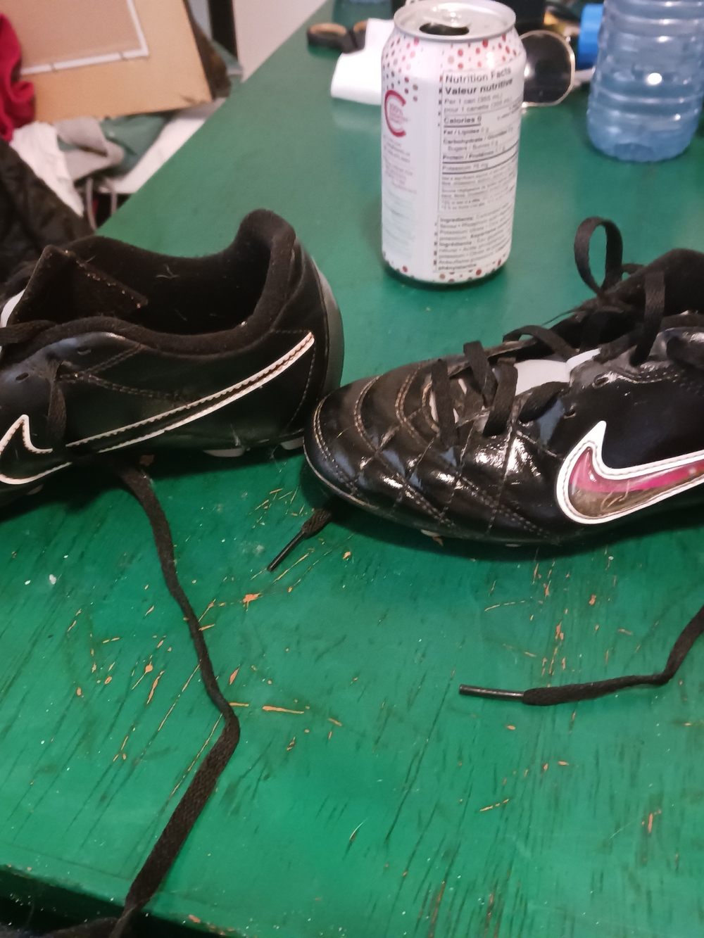 Nike Kids Black Soccer Boots with Pink Swoosh Accent